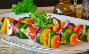 Colorful balanced plate with whole grains, lean protein, vegetables, diabetes control.